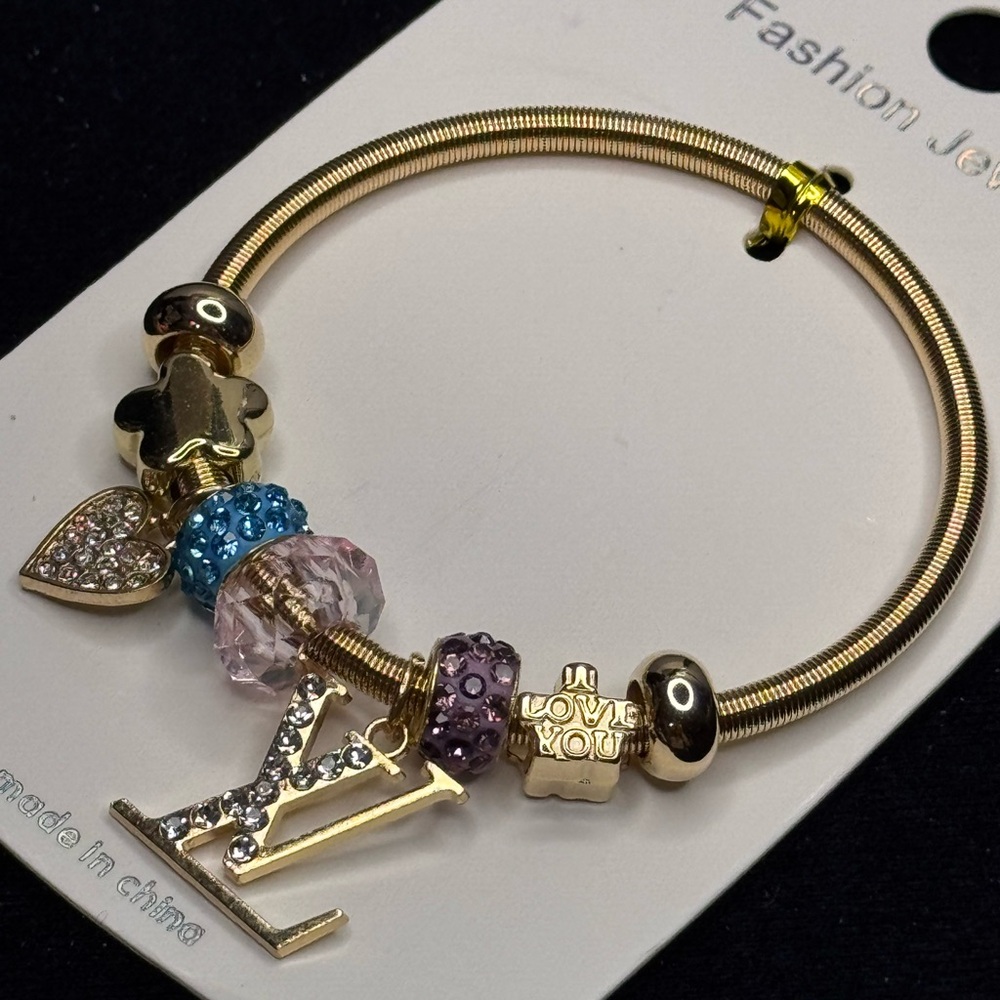 Fashion Jewelry Gold Tone Sparkling Heart
Charm Stretch Bracelet Blue Purple